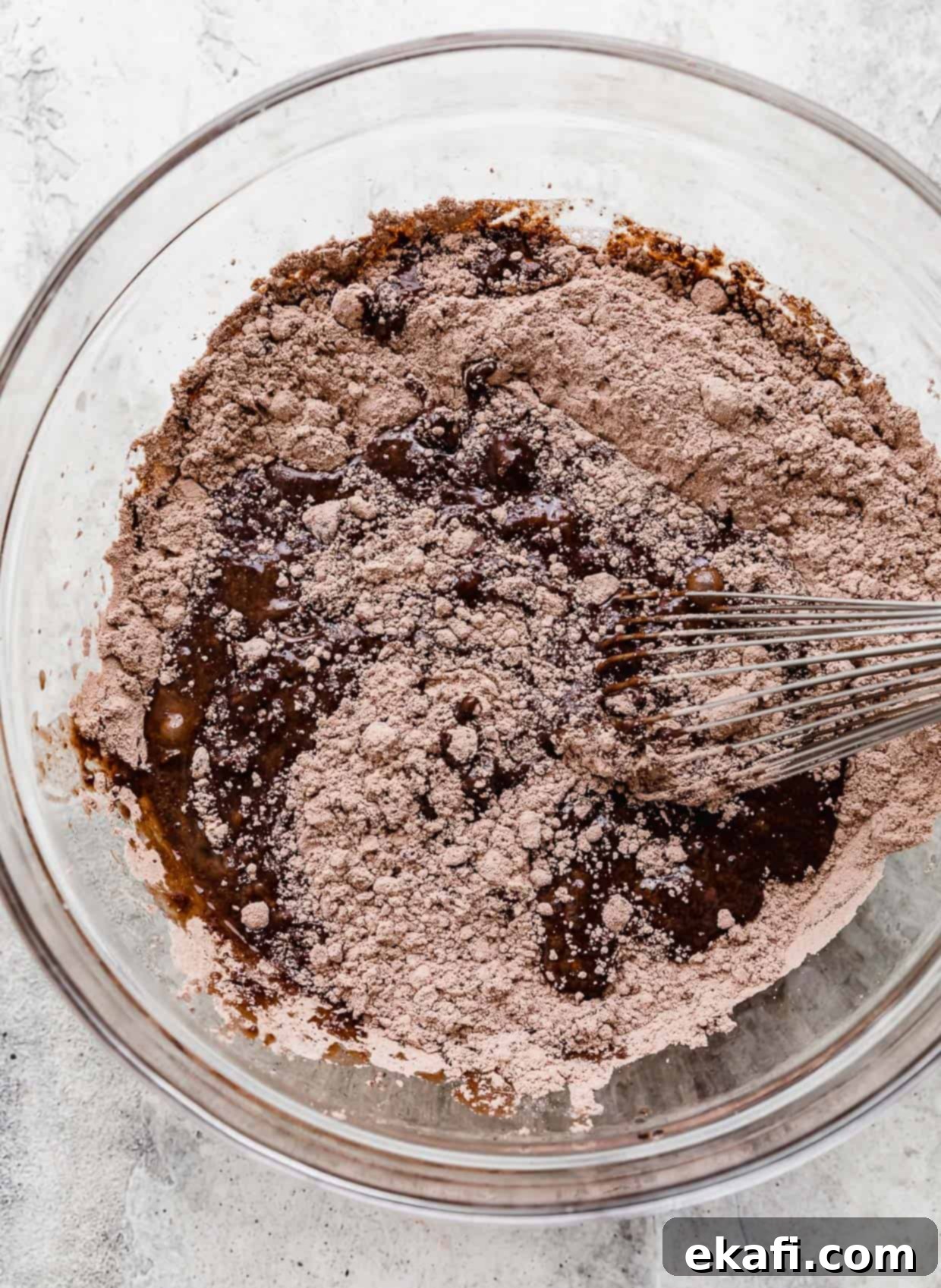 Ultimate Oreo Fudge Brownies 4 Brownie batter being mixed in a glass bowl.