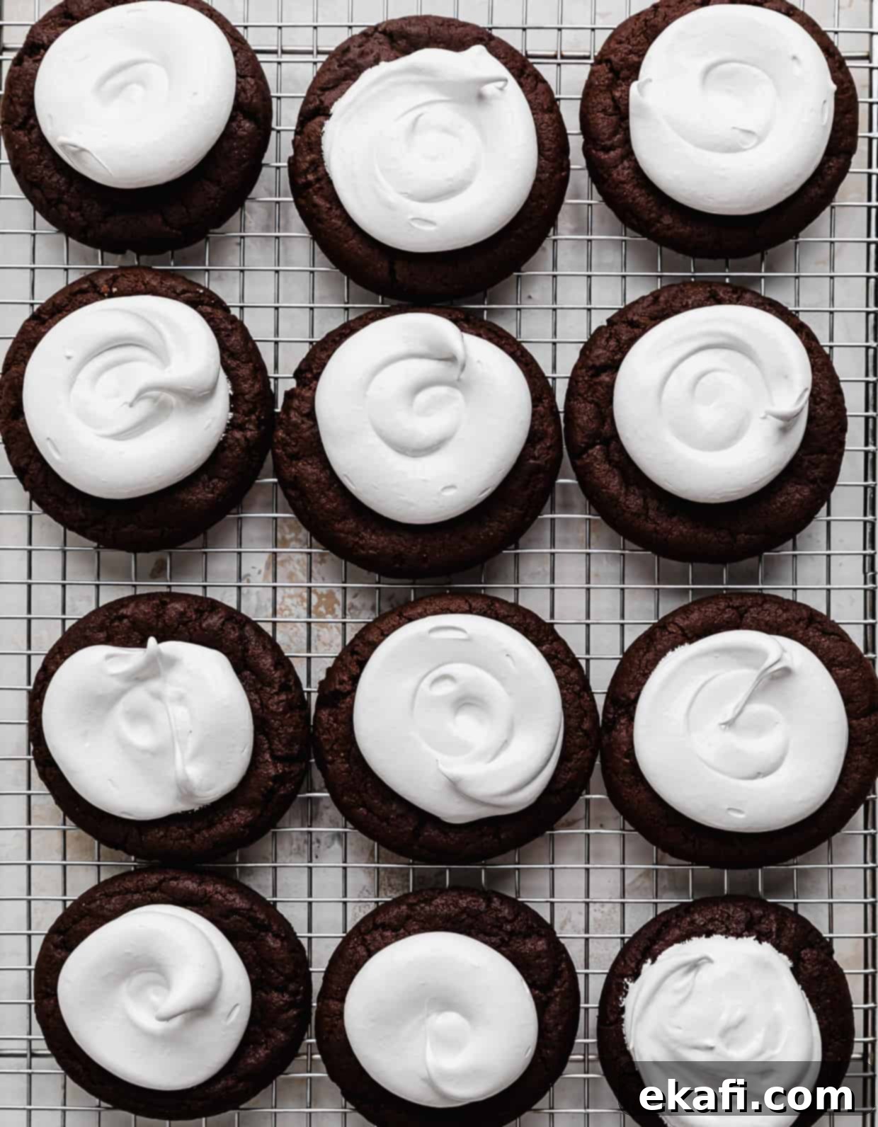 Hostess Cupcake Cookies 7 Freshly baked chocolate cookies beautifully topped with a generous swirl of marshmallow meringue frosting, awaiting the chocolate ganache and white chocolate details.