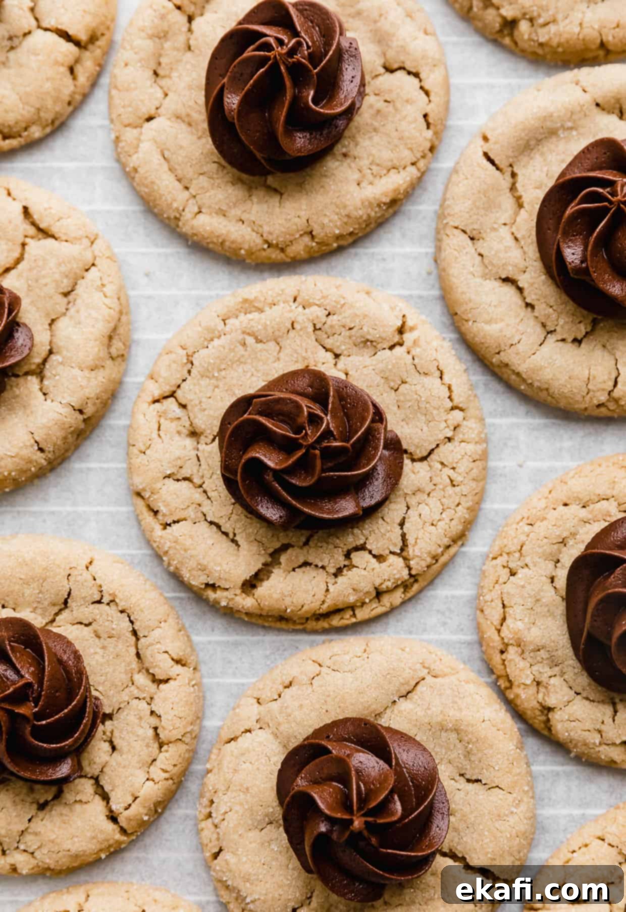 Crumbl Peanut Butter Blossoms 9 Crumbl Peanut Butter Blossom Cookies topped with a swirl of chocolate fudge frosting in the center of each cookie.
