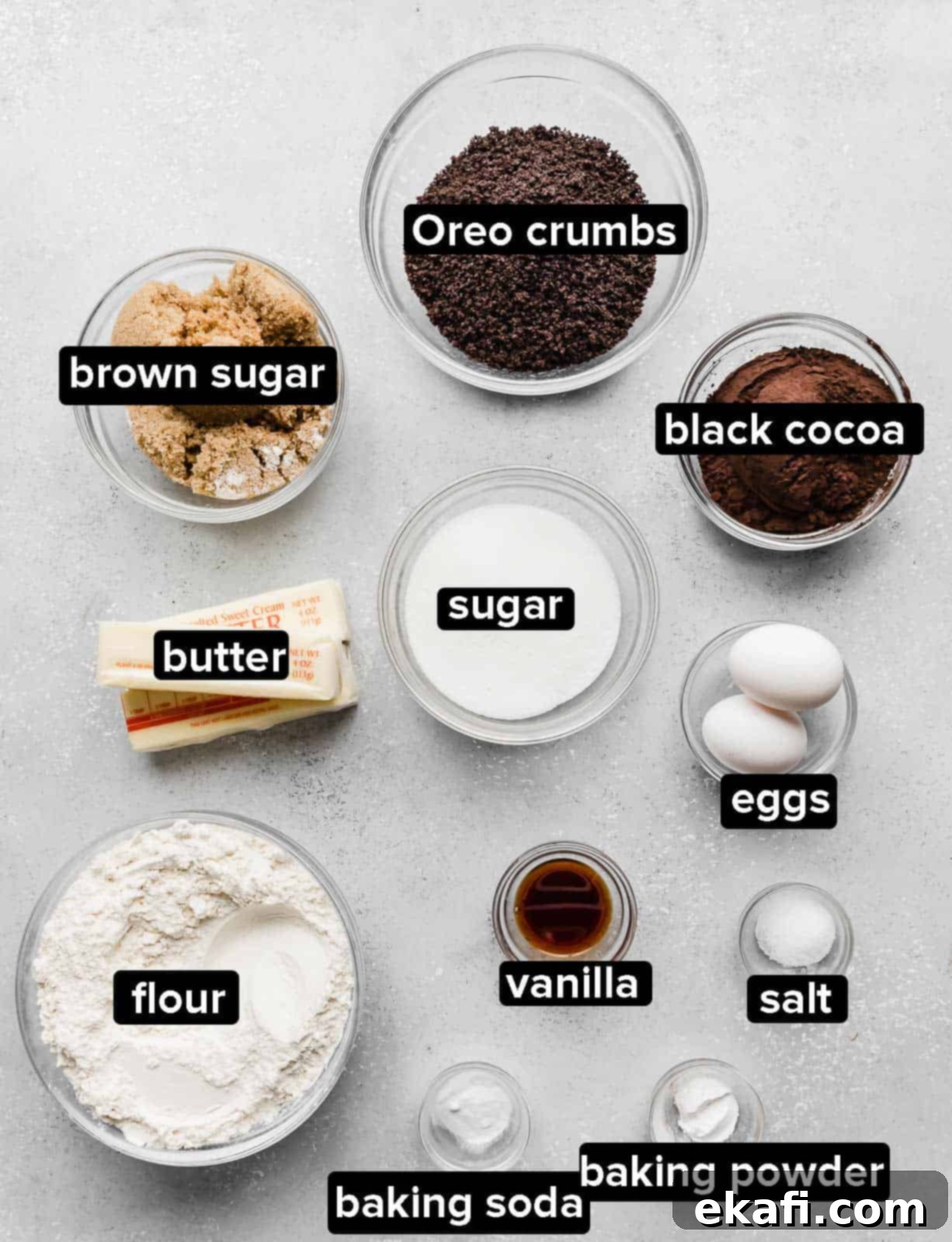 Decadent French Silk Pie Cookies 3 Chocolate Oreo Crumbl Cookie ingredients on a gray background.