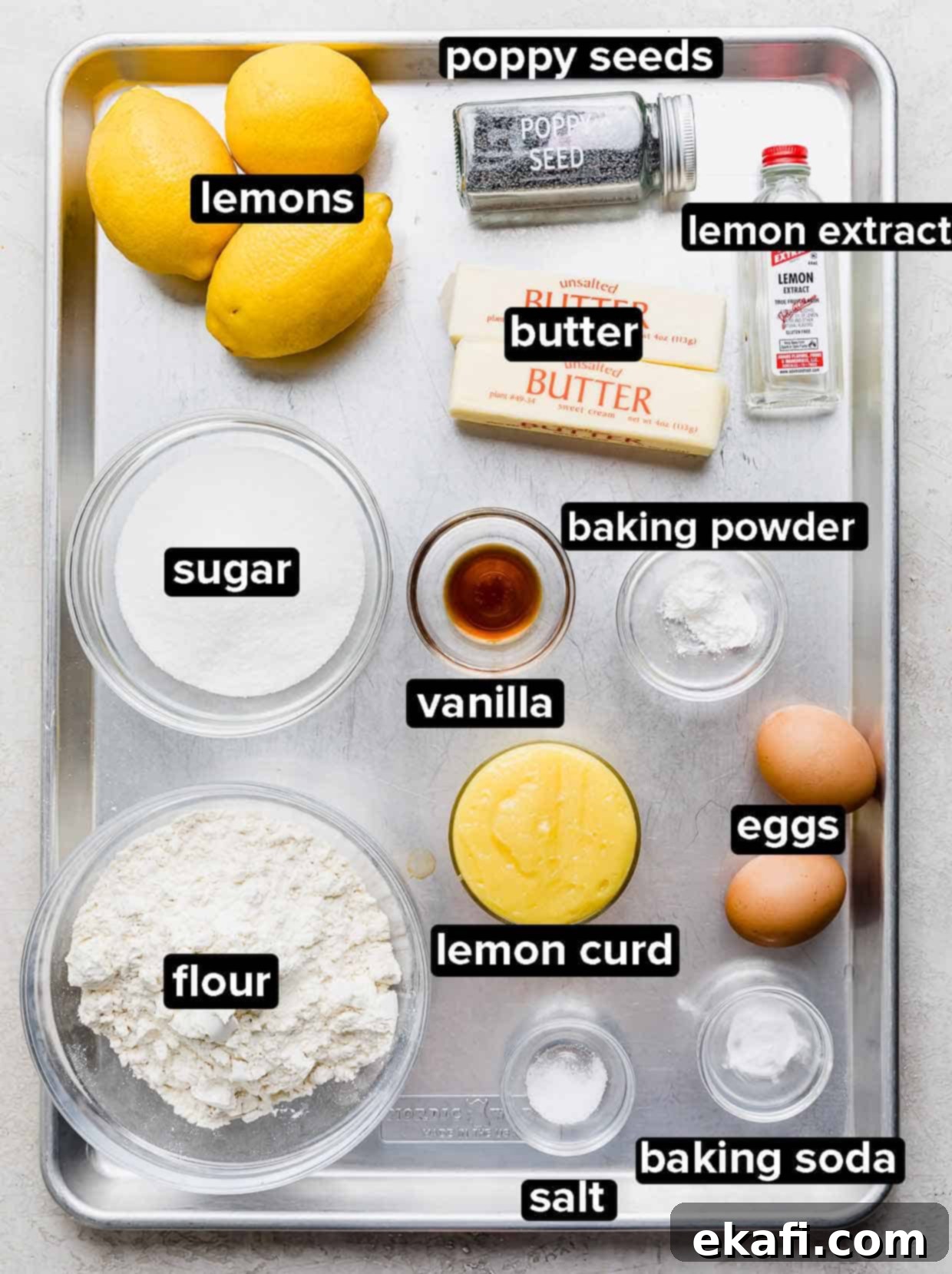 Zesty Lemon Poppy Seed Delights 3 Lemon Poppy Seed Cookie ingredients portioned into glass bowls on a baking sheet.