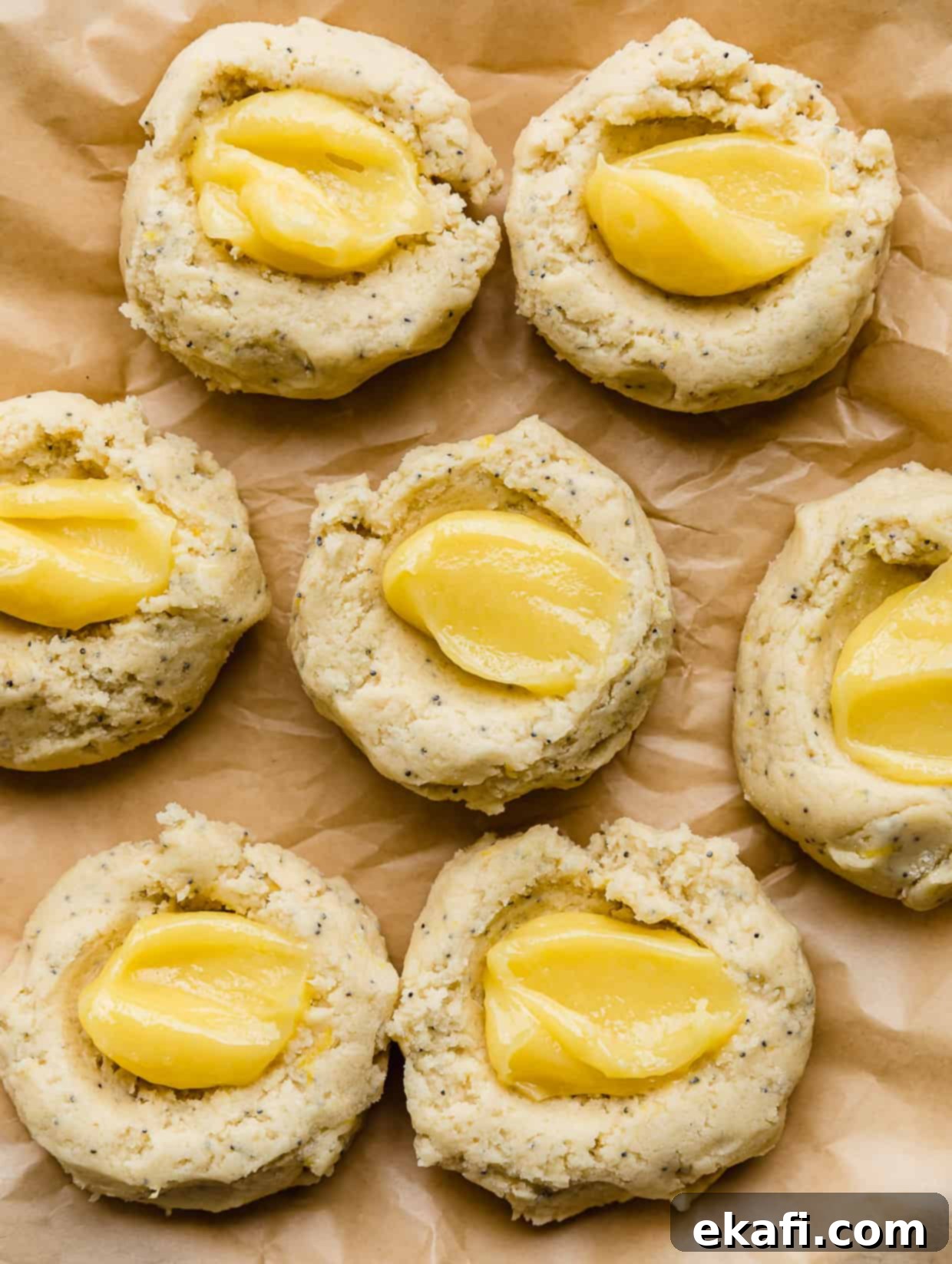 Zesty Lemon Poppy Seed Delights 8 Lemon curd in dollop in the centers of lemon poppy seed cookie dough.