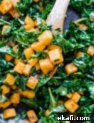 Roasted Butternut Squash and Kale 8 A close up photo of perfectly cooked cubed Butternut Squash and tender Kale.