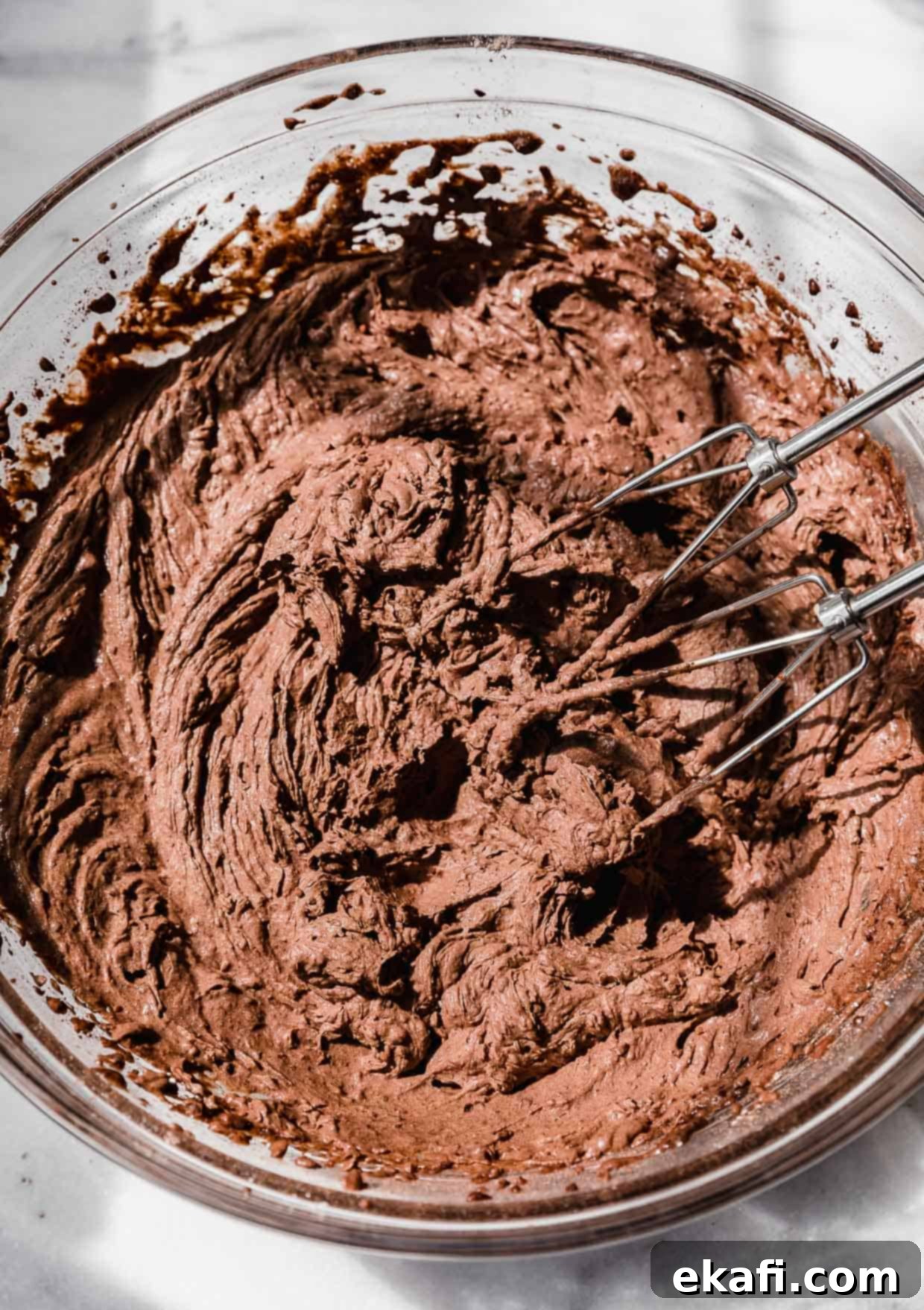 Oreo Mud Pie Cookies 10 Chocolate pudding frosting in a glass bowl.
