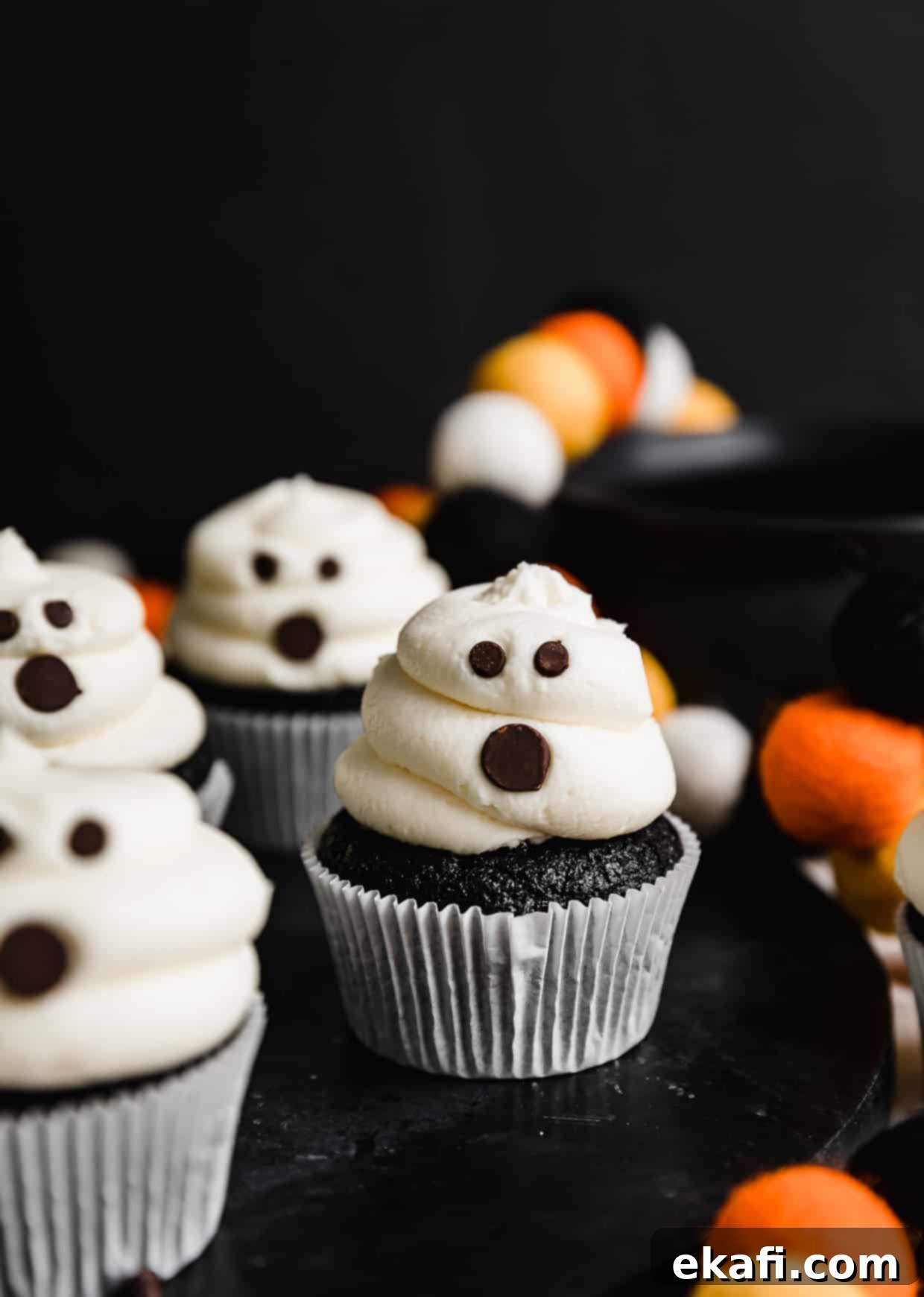 Phantom Frosted Treats 8 Ghost Cupcakes against a black background.