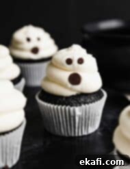 Phantom Frosted Treats 9 Ghost Cupcakes against a black background.