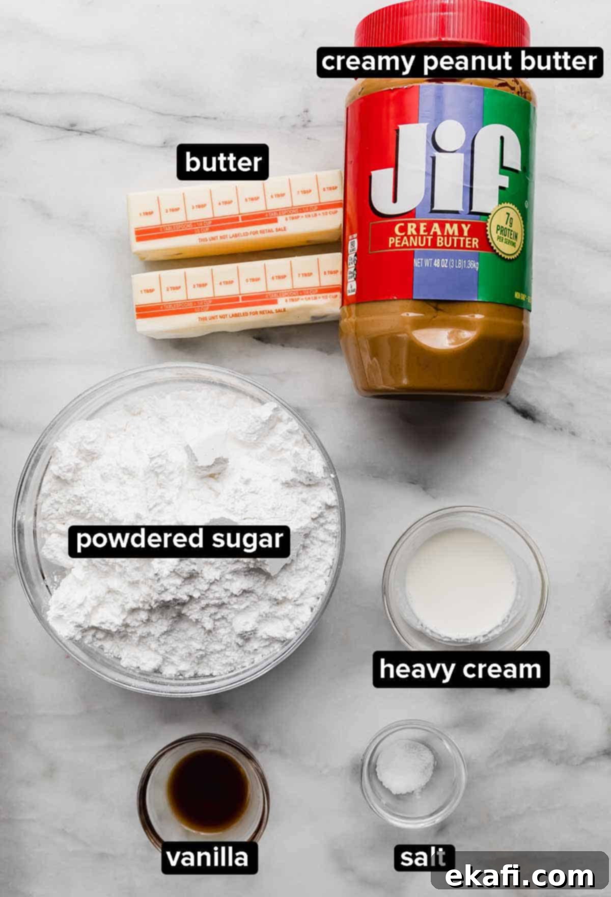 Reeses Peanut Butter Cupcakes 4 Peanut butter frosting ingredients on a white background: creamy peanut butter, butter, powdered sugar, salt, heavy cream, and vanilla.