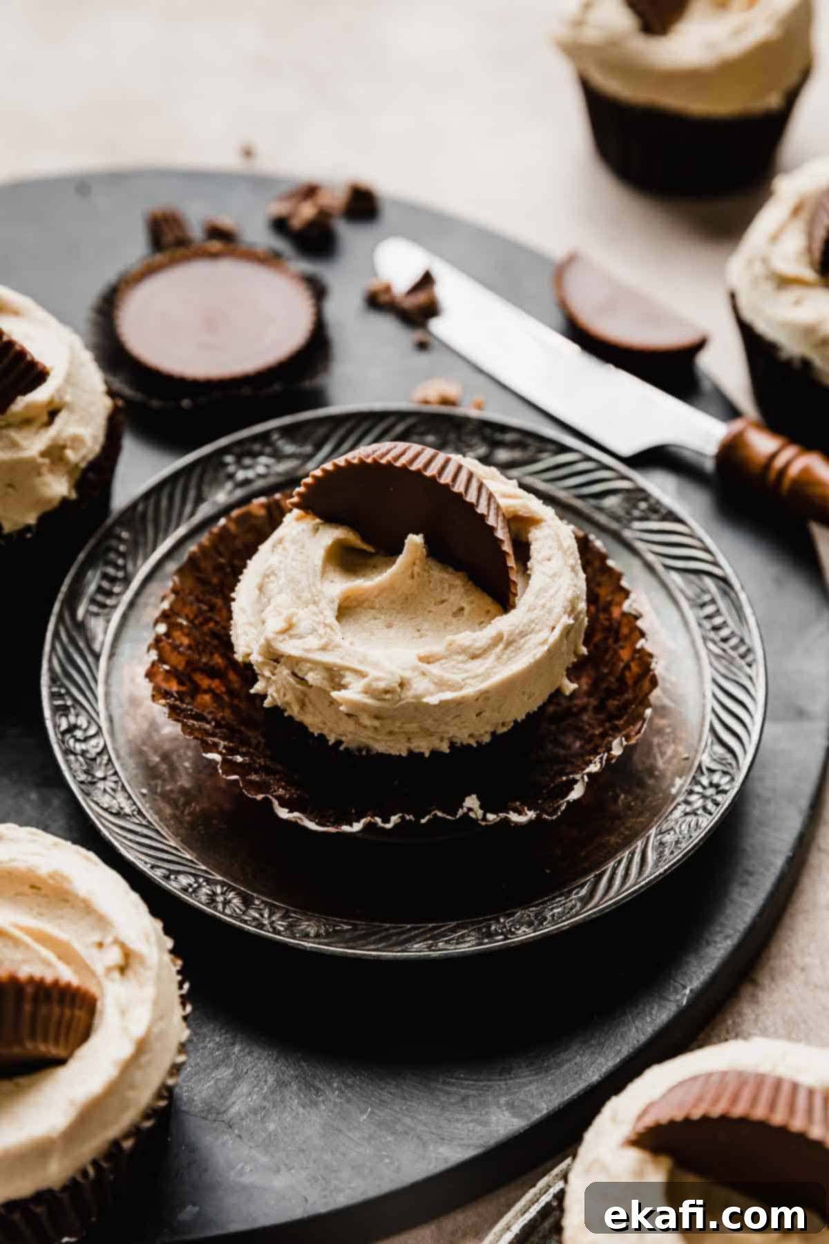 Reeses Peanut Butter Cupcakes 7 A Reeses Cupcake topped with peanut butter frosting and half of a Reese's peanut butter cup.
