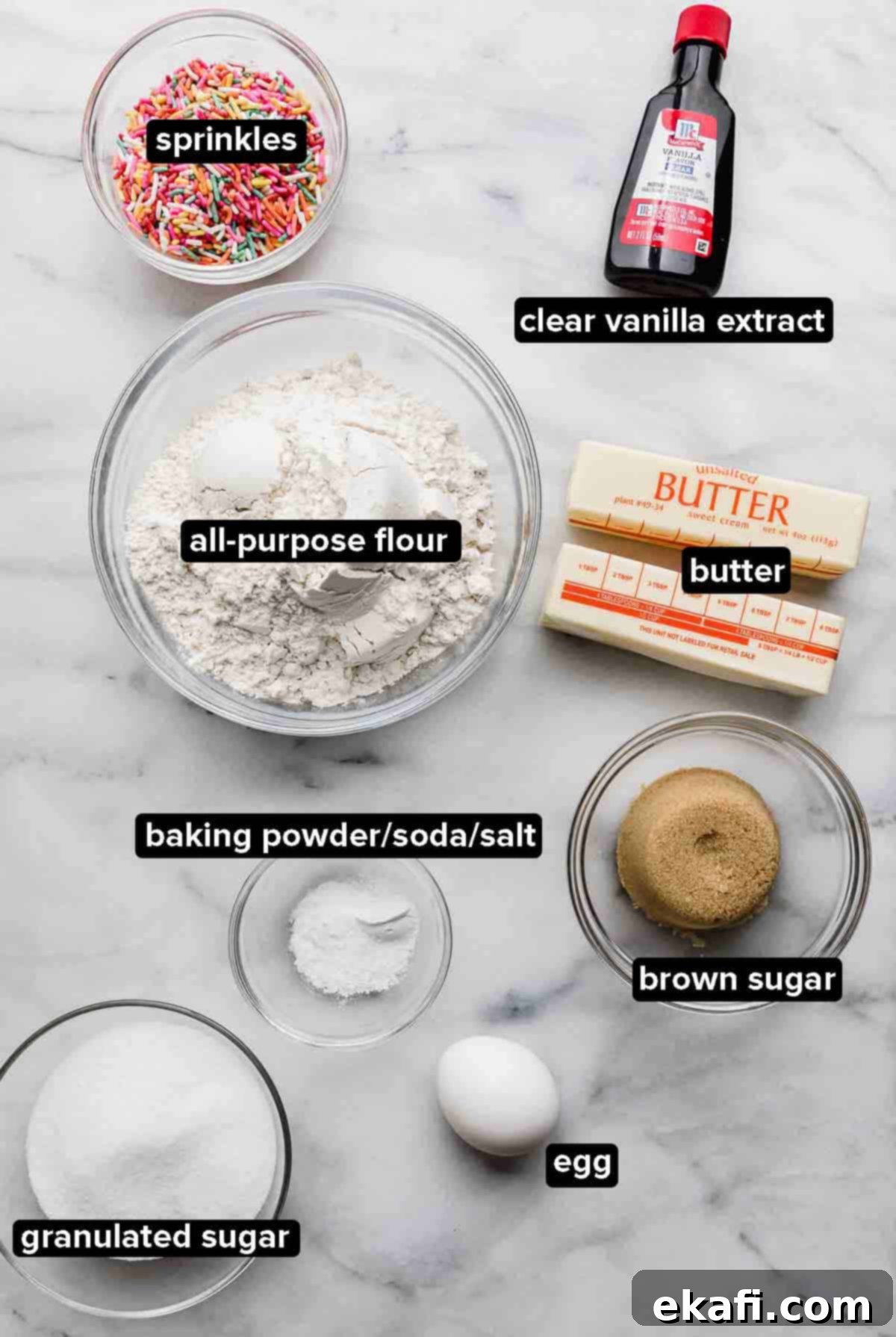 Celebration Cookies 3 Assorted Funfetti Cookie ingredients meticulously portioned into clear glass bowls on a clean white background, including clear vanilla extract, vibrant rainbow sprinkles, all-purpose flour, granulated sugar and light brown sugar, unsalted butter, a large egg, and leavening agents like baking powder and baking soda.