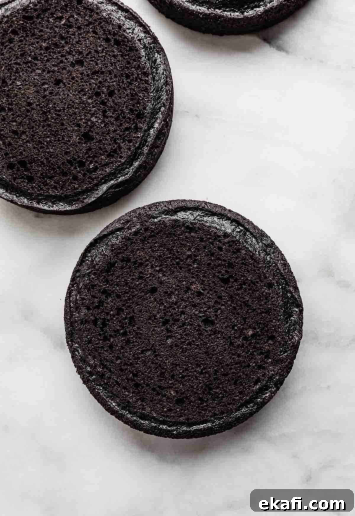 Decadent Oreo Dream 4 Black cocoa powder cake layers on a white background.