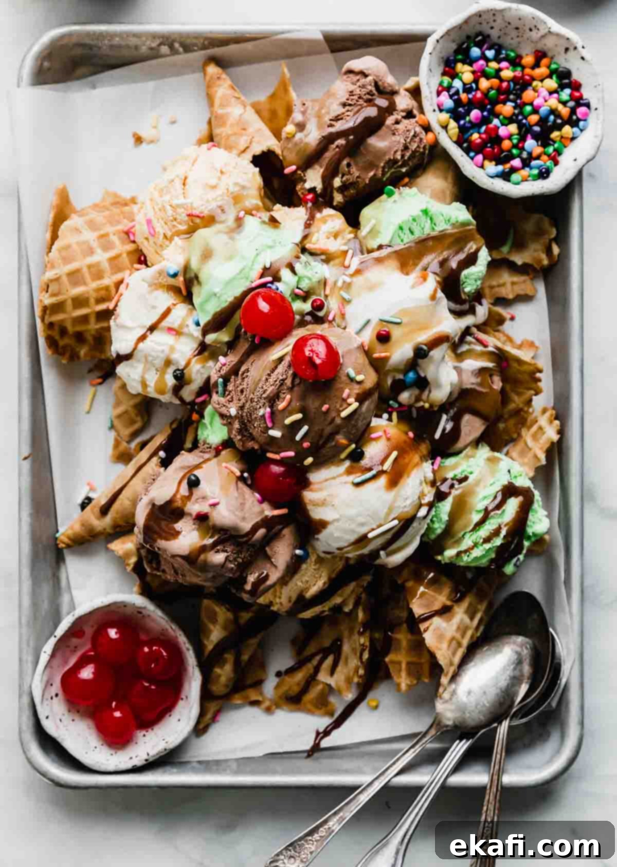 The Sweet Scoop Fiesta 2 Waffles cones crushed underneath scoops of vanilla, chocolate, and mint ice cream with hot fudge, butterscotch sauce, and sprinkles over the Ice Cream Nachos.