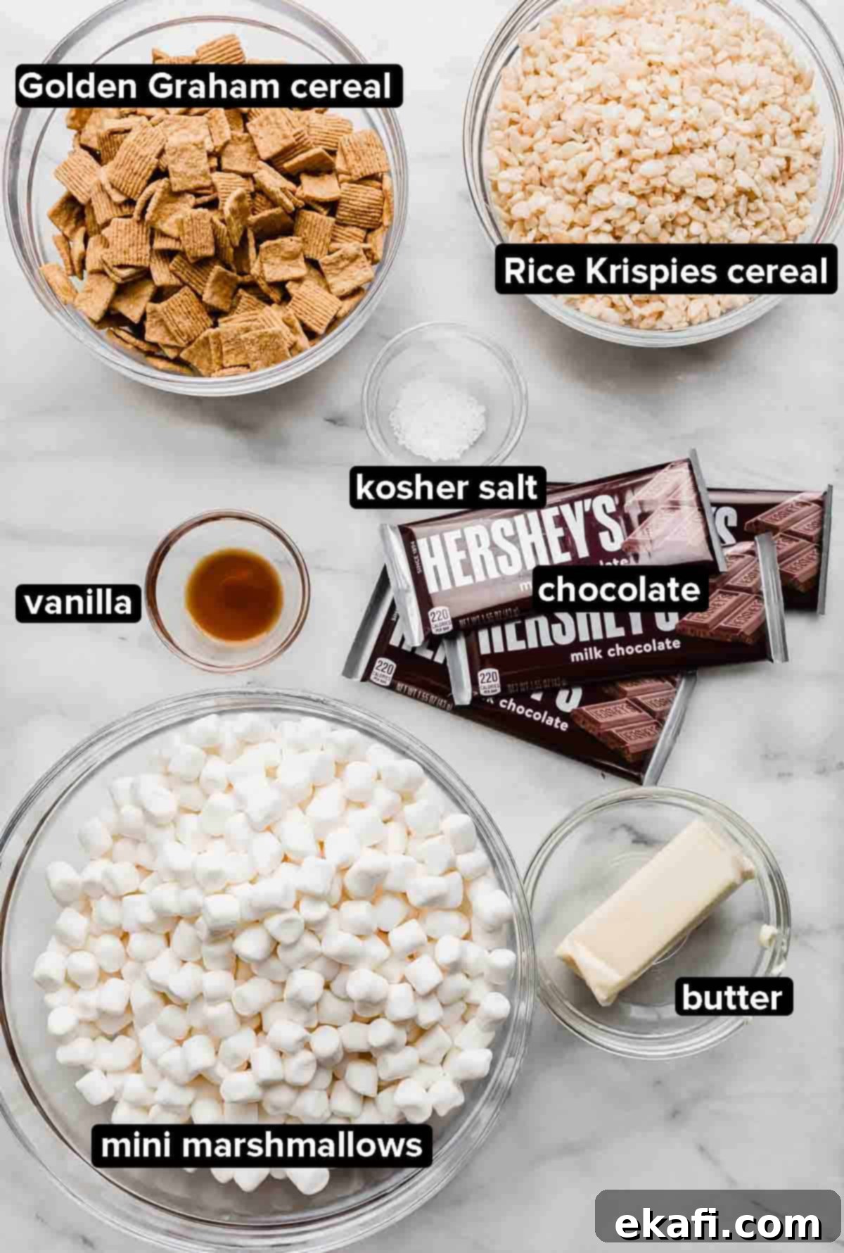S'more Rice Krispie Treats 3 S'more Rice Krispie Treats ingredients on a gray and white marble background.