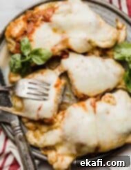 Pesto Parmesan Chicken 6 Pesto Chicken Parmesan on a gray plate.