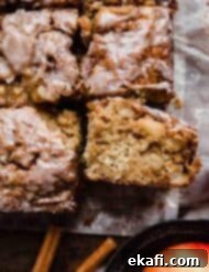 Baked Apple Fritter Delight 9 Close up photo of the best Apple Fritter Cake on parchment paper.