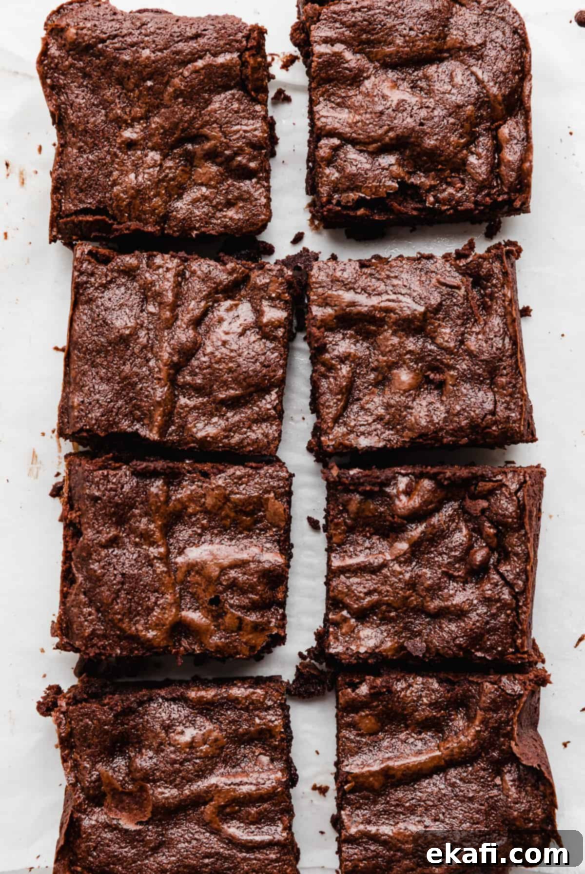 Brownies for Two 6 Eight perfectly cut squares of small batch brownies arranged elegantly on a pristine white background, inviting you to indulge in their rich, dense texture.