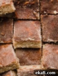 Chewy Snickerdoodle Blondies 8 Close up image of Snickerdoodle Bars cut into squares, and topped with cinnamon sugar mixture.
