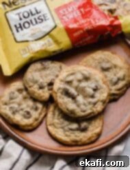 Nestle Toll House Signature Chocolate Chip Cookies 7 Nestle Toll House Chocolate Chip Cookies on a brown plate, ready to be enjoyed.