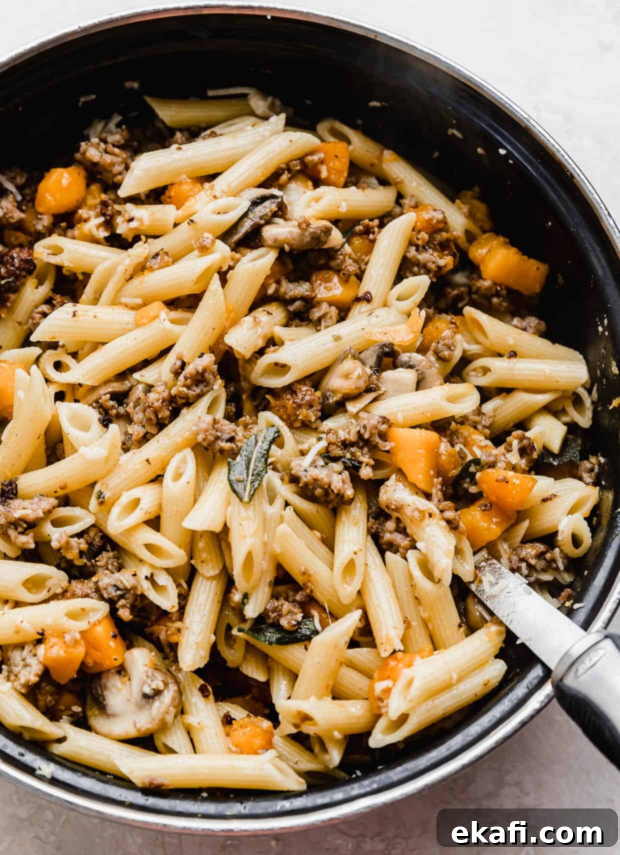 Butternut Squash Sausage Pasta 7 Butternut Squash Mushroom Pasta with sage and parmesan, in a large black pot, served family style.