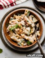 Elote Fiesta Pasta Salad 8 Creamy Mexican Street Corn Pasta Salad recipe in a brown bowl on a white marble surface.