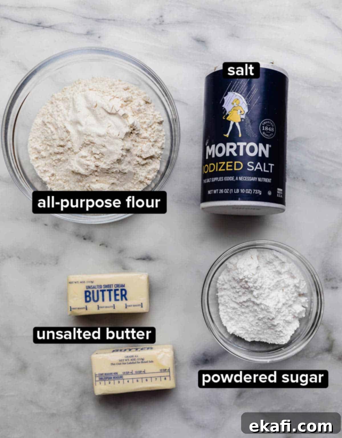 Buttery Shortbread Pie Base 3 Shortbread Pie Crust ingredients on a marble surface: flour, salt, butter, and powdered sugar.