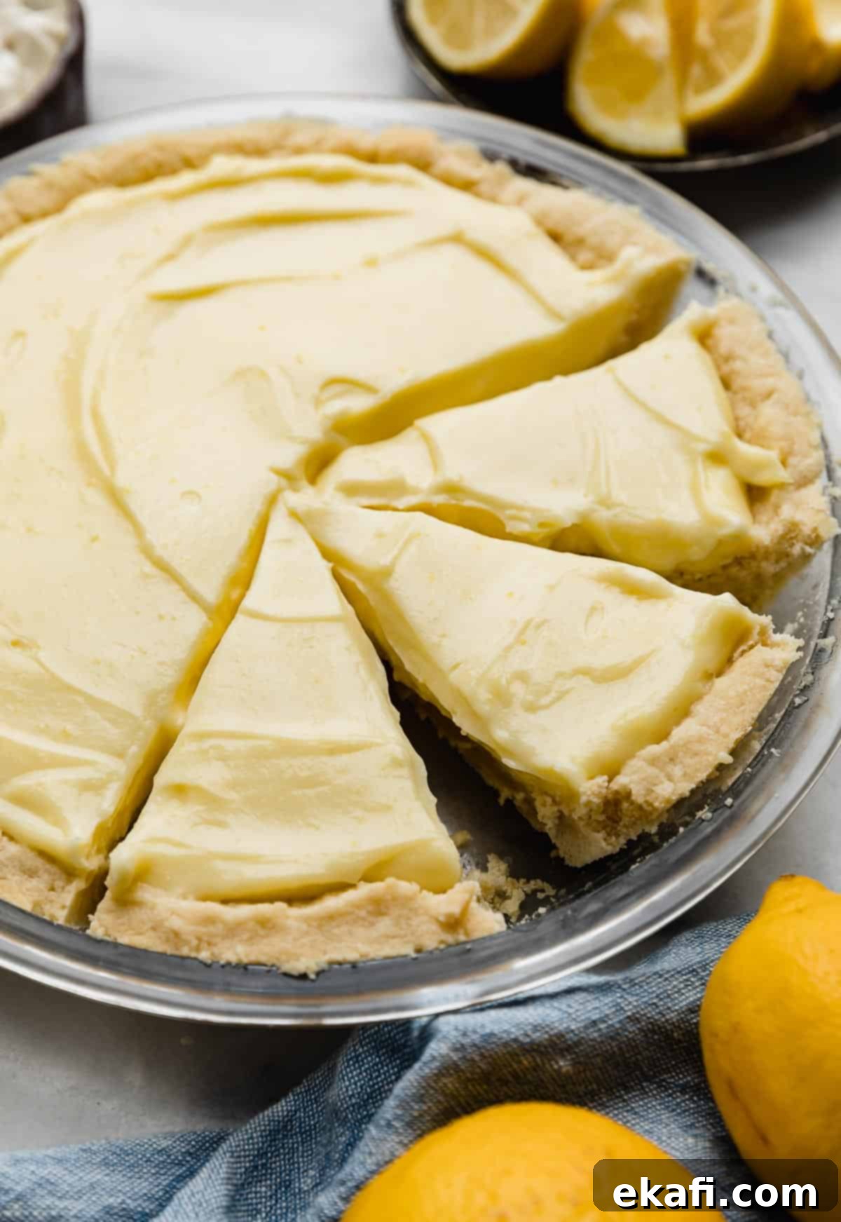 Buttery Shortbread Pie Base 6 Lemon sour cream pie filling in a shortbread pie crust, with three pie slices cut.