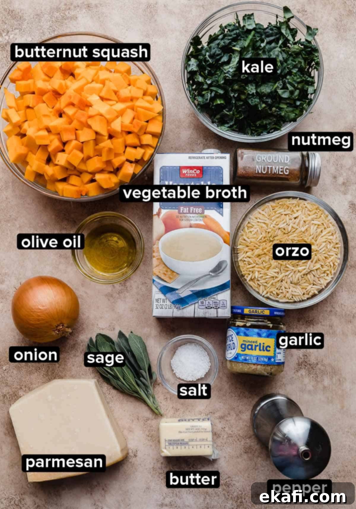 Creamy Butternut Squash Orzo 3 Butternut Squash Orzo recipe ingredients on a light brown background: kale, butternut squash, orzo, vegetable broth, parmesan, onion, sage and butter.