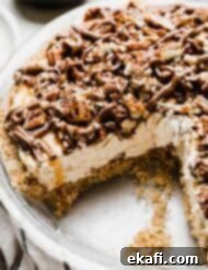 Caramel Pecan Utopia 9 A turtle pie with a pecan crust, caramel cream cheese filling, and chocolate caramel pecan topping.