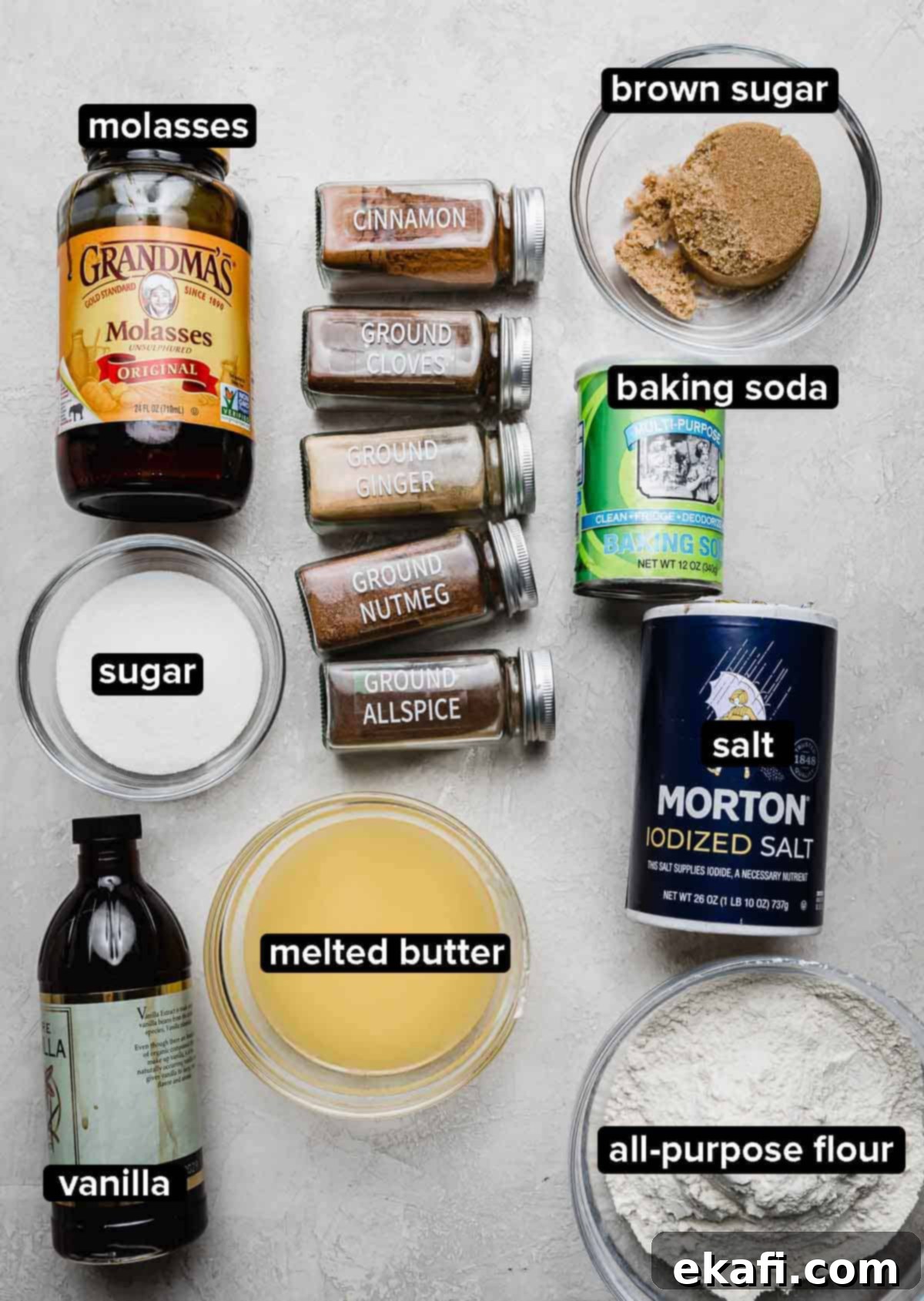 Soft & Chewy Gingerbread Bars 3 Gingerbread Cookie Bar recipe ingredients on a light gray background: molasses, sugar, butter, dry ingredients, salt, and gingerbread spices.