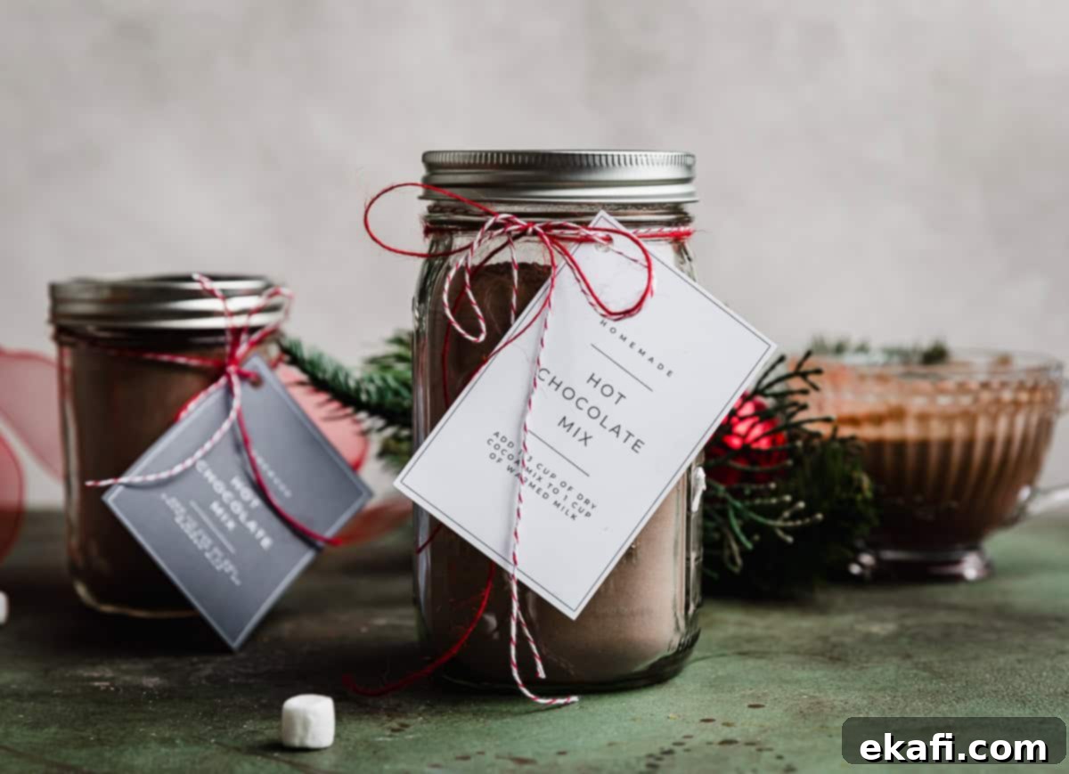 Homemade Hot Chocolate Delight 6 Homemade Hot Chocolate Mix in a large mason jar with a homemade hot cocoa mix tag tied to the jar with a red string.