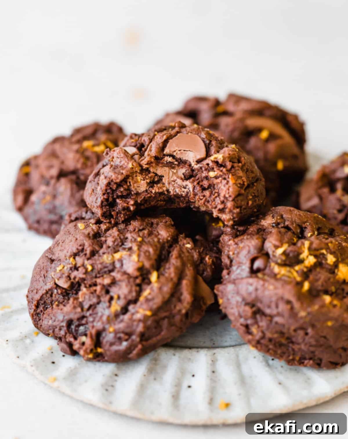 Irresistible Chocolate Orange Cookies 7 Chocolate Orange Cookies stacked on a plate.