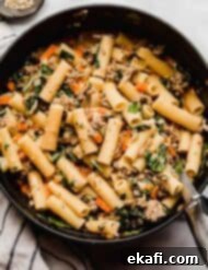 Italian Sausage Rigatoni 9 Carrot, onion, celery, and spinach loaded Italian Sausage Rigatoni in a large pot.