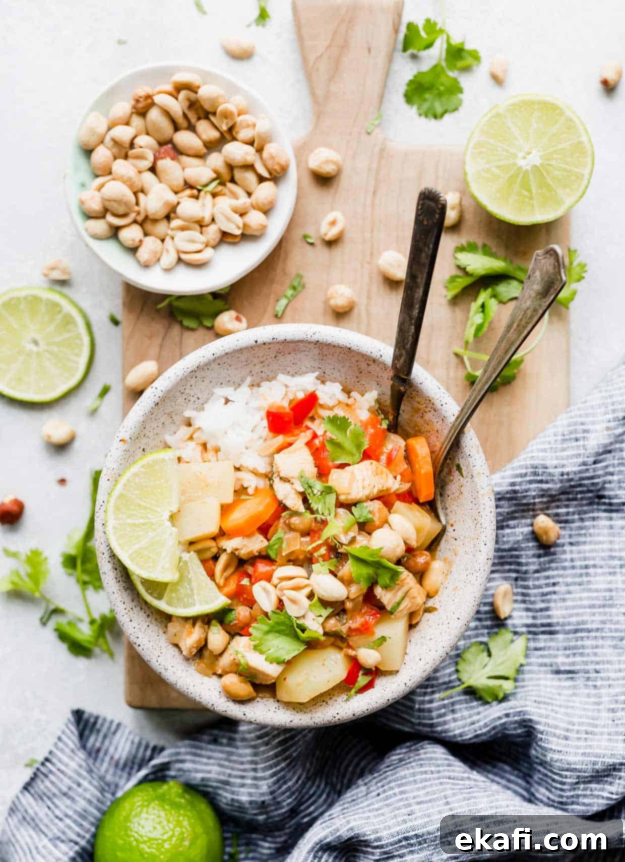 The Royal Massaman Curry 10 A bowl with an easy Massaman Curry topped with lime, cilantro, and peanuts.