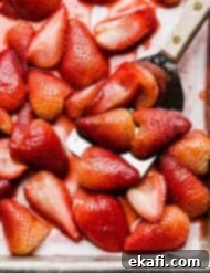 Sweet Baked Strawberries 6 Baked strawberries recipe on a baking sheet, ready to be served or stored.