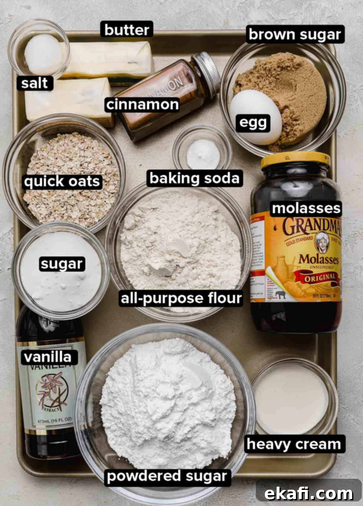 Soft Chewy Oatmeal Cream Sandwiches 3 Homemade Oatmeal Creme Pie ingredients portioned into glass bowls on a gold baking sheet, showcasing fresh butter, sugars, oats, and spices.