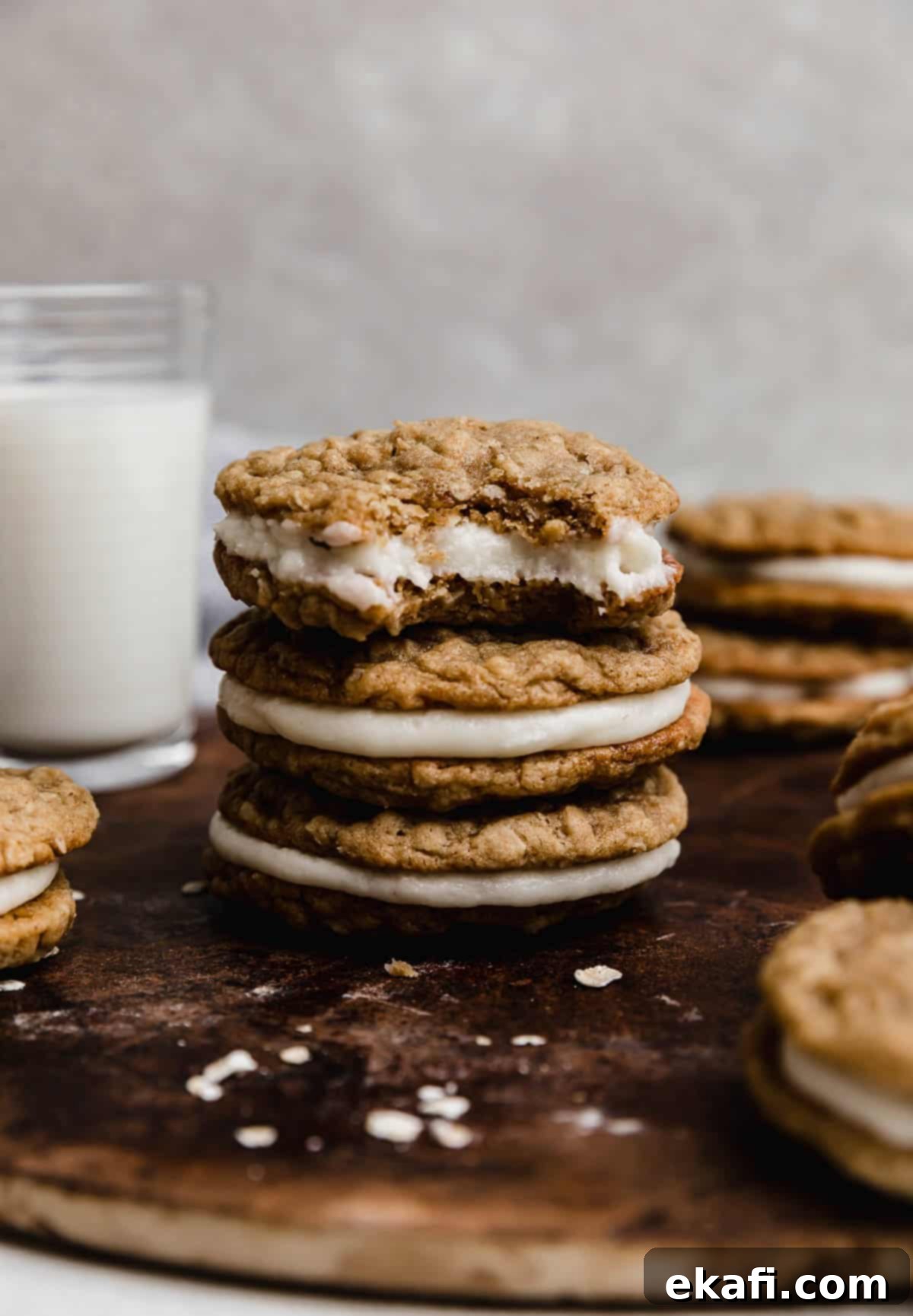 Soft Chewy Oatmeal Cream Sandwiches 7 Three oatmeal creme pie cookies stacked, with the top cookie having a bite removed from it, showing the soft interior.