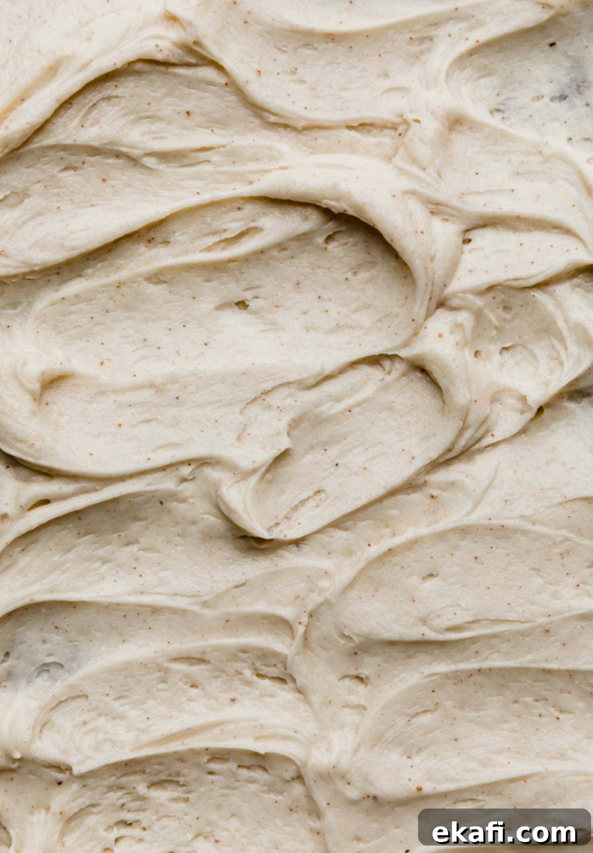 Golden Brown Butter Cream Cheese Frosting 5 Swirled easy Brown Butter Cream Cheese Frosting recipe on a cake or other type of dessert.