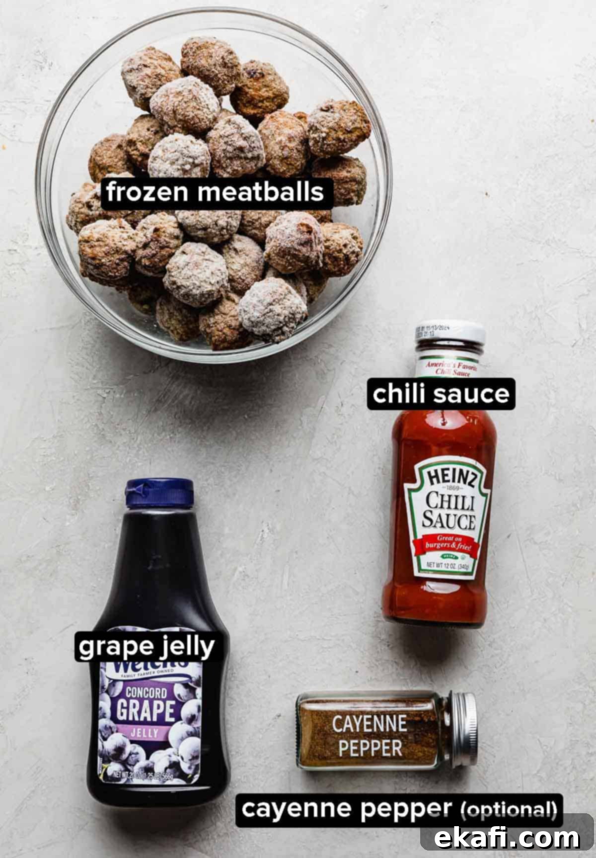 Sweet and Tangy Slow Cooker Meatballs 3 Grape Jelly Meatball ingredients on a white background: frozen meatballs, grape jelly, chili sauce, and cayenne pepper.
