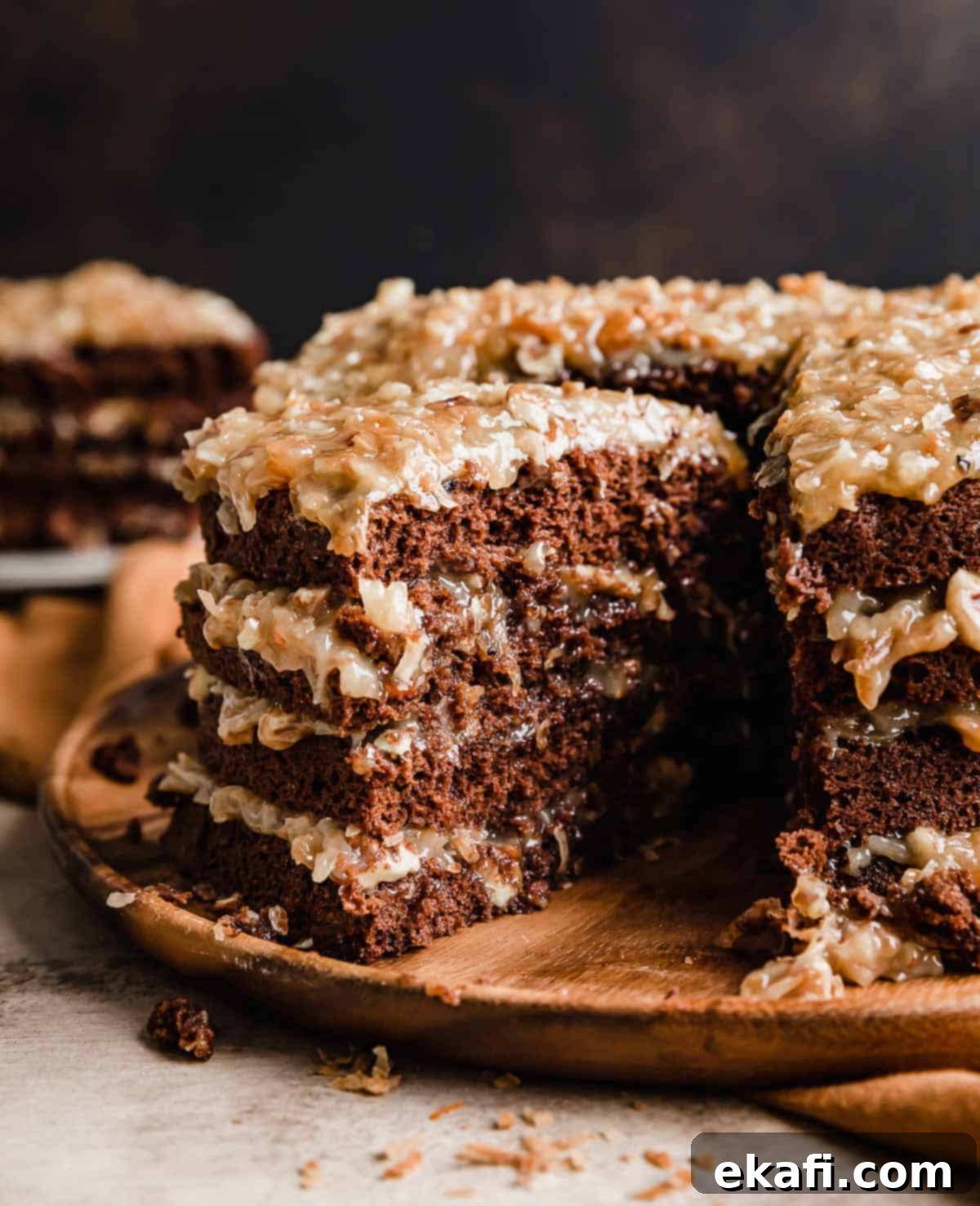Decadent German Chocolate Creation 2 A four layer A traditional German Chocolate Cake recipe with a slice cut from the main cake.