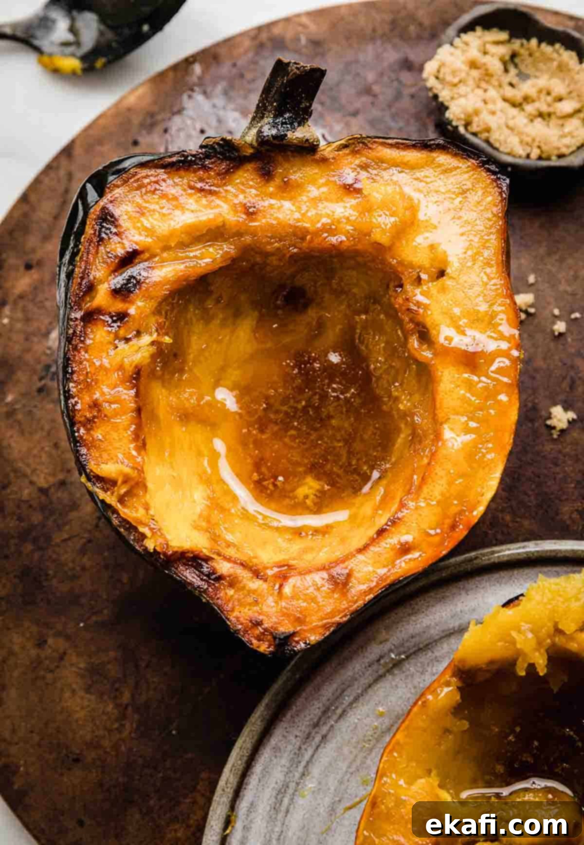 Caramelized Brown Sugar Acorn Squash 6 Roasted acorn squash with brown butter brown sugar mixture in the center of the squash.