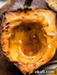 Caramelized Brown Sugar Acorn Squash 7 Brown Sugar Acorn Squash on a brown plate.