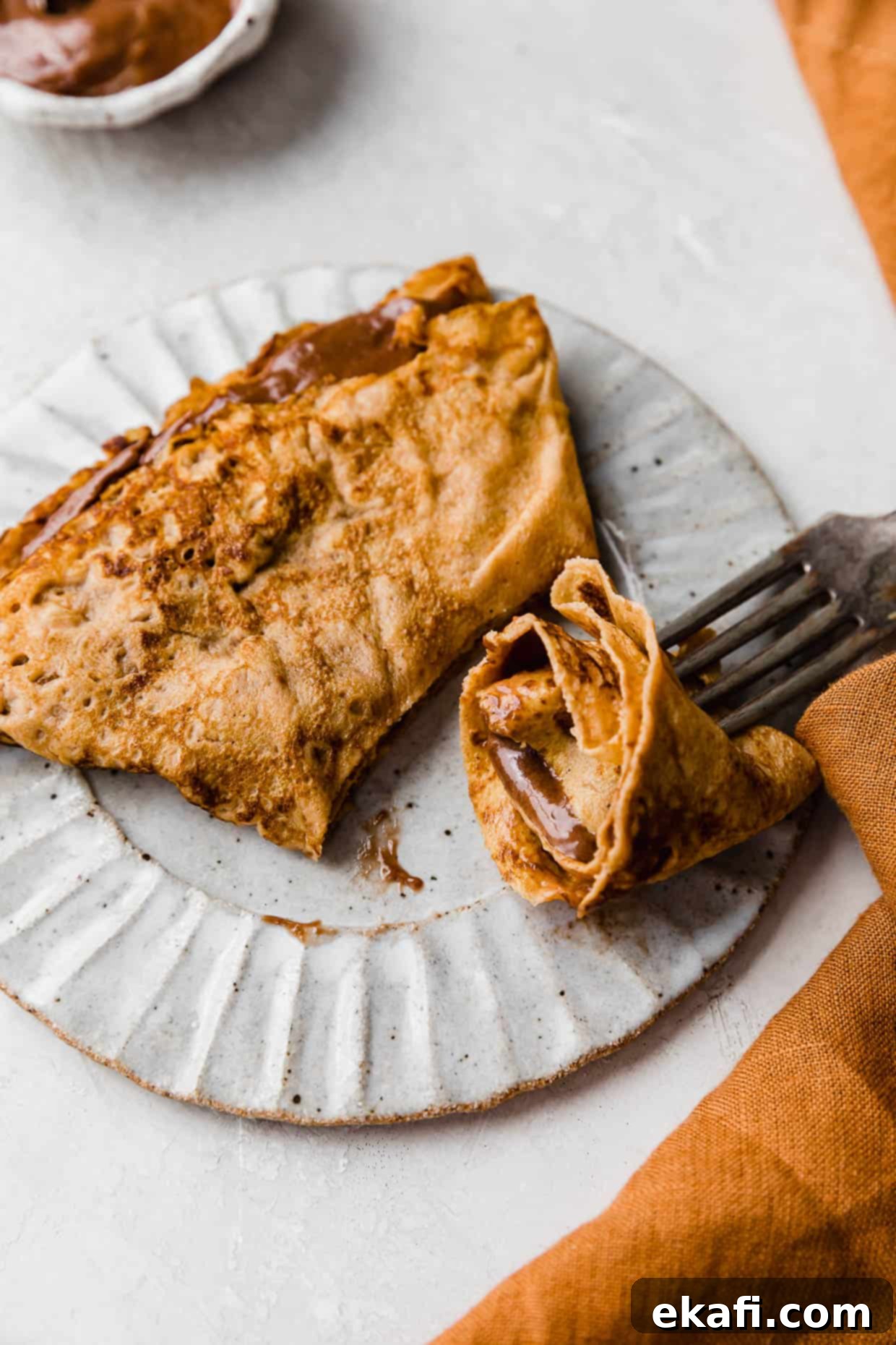 Autumn Pumpkin Crepes 7 A Pumpkin Crepe filled with nutella whipped cream, cut into.