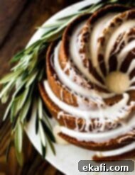 Spiced Gingerbread Bundt Delight 7 Top view of a gingerbread bundt cake with maple glaze.