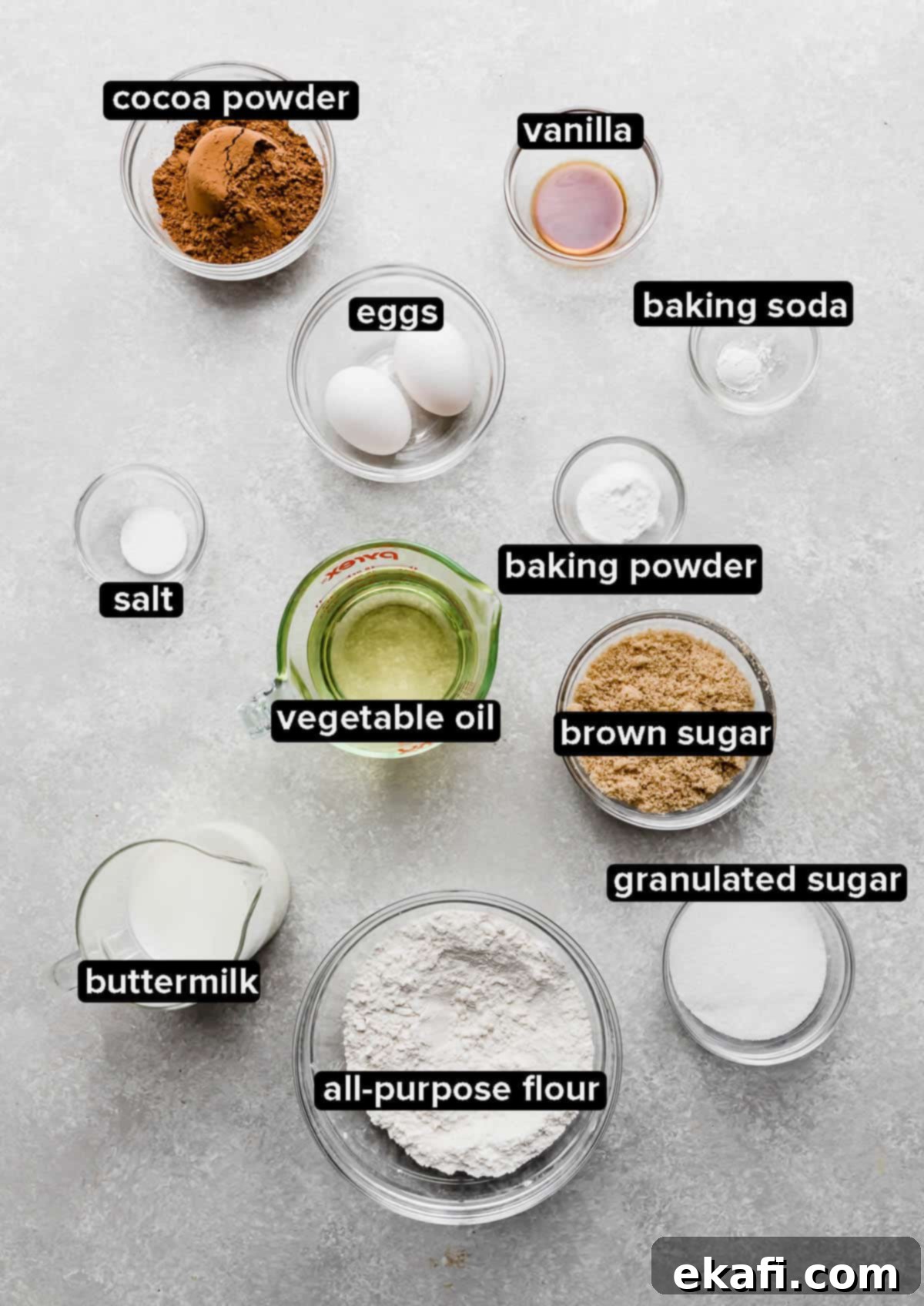 Irresistibly Rich Chocolate Cupcakes 3 The Best Chocolate Cupcake recipe ingredients in glass bowls on a light gray background.