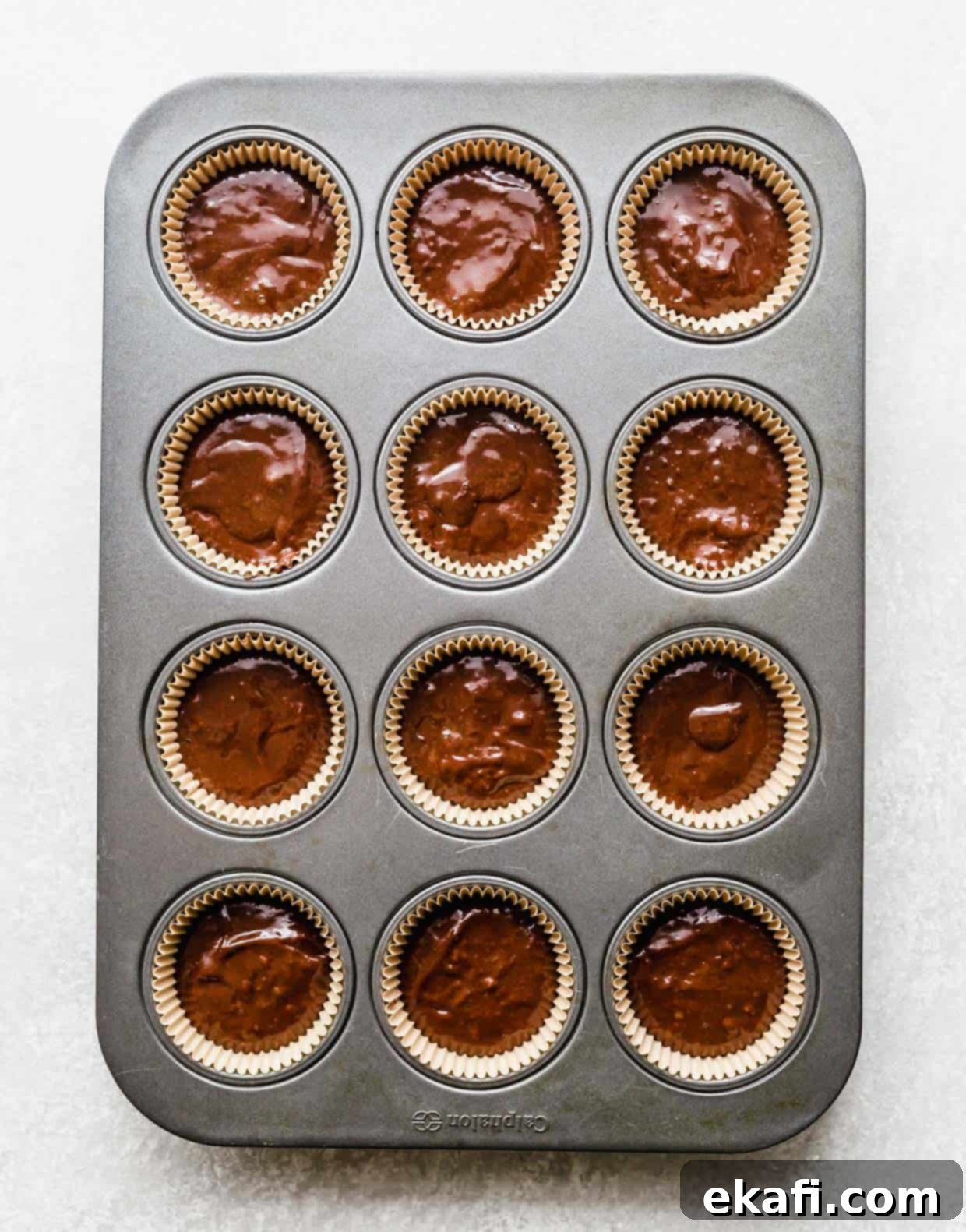 Irresistibly Rich Chocolate Cupcakes 7 Chocolate cupcake batter in cupcake lined cupcake tin.