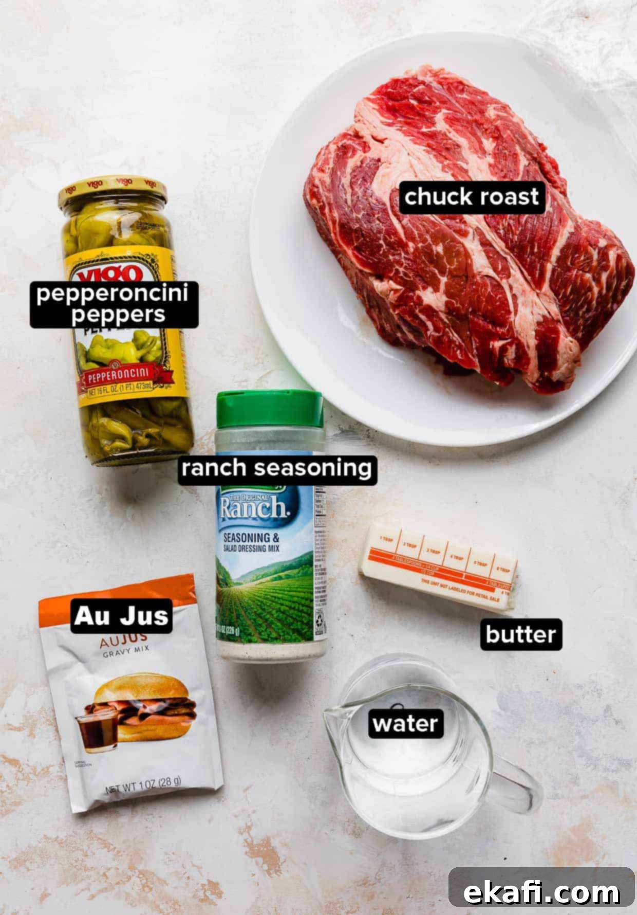 Southern Comfort Mississippi Pot Roast 3 Mississippi Pot Roast ingredients on a white background: beef chuck roast, pepperoncini peppers, ranch seasoning, butter, water, and au jus.