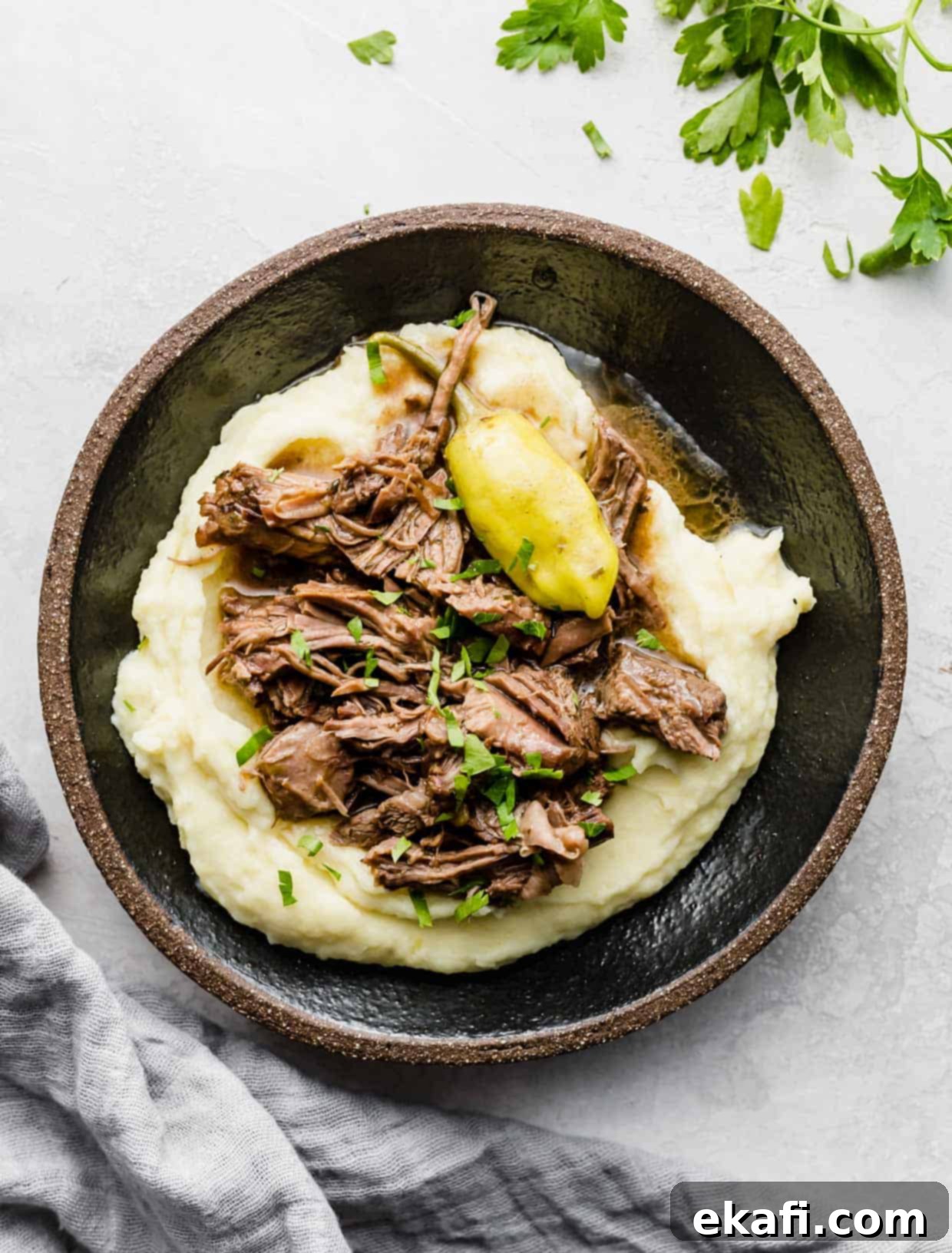 Southern Comfort Mississippi Pot Roast 6 Easy Mississippi Pot Roast made in a slow cooker, shredded on top of mashed potatoes.
