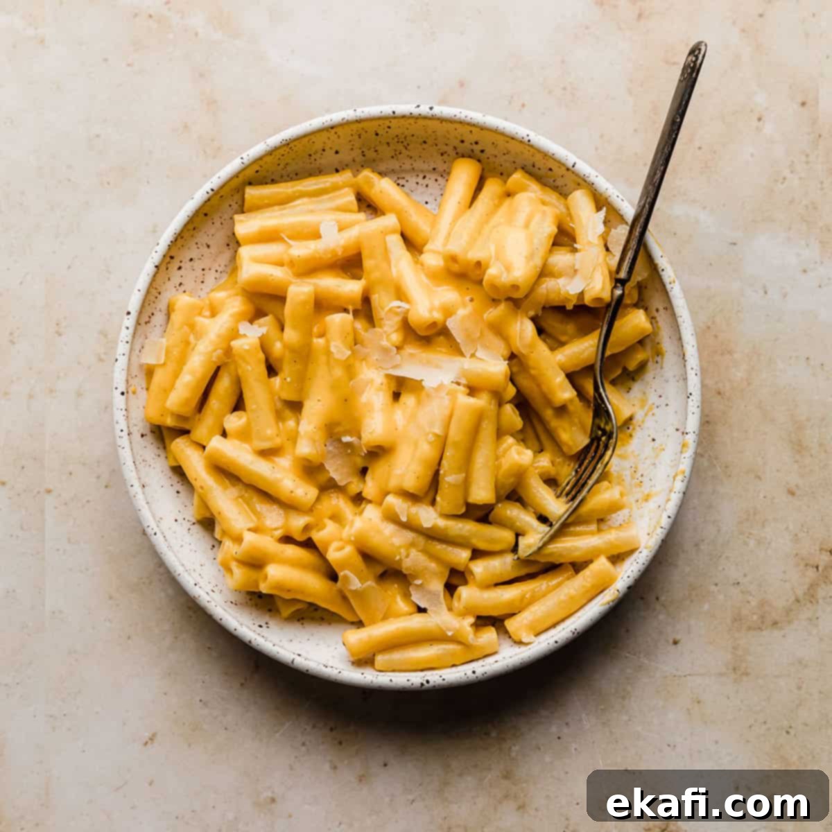 Happy Tummies Happy Kids 17 Ziti noodles generously covered in a velvety, creamy orange butternut squash pasta sauce, creating a comforting and healthy dish.