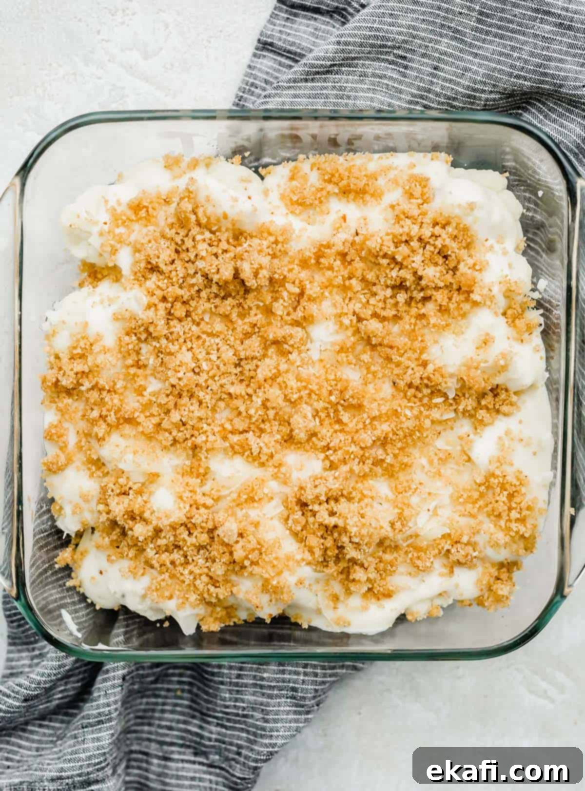 Creamy Baked Cauliflower 6 Breadcrumb topped Cauliflower Gratin in a square baking dish.