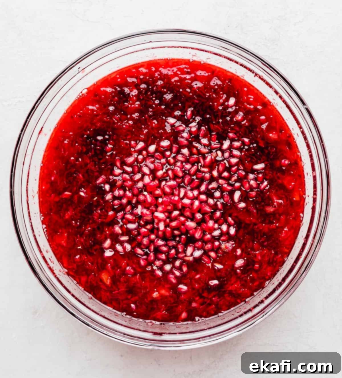 Ruby Pomegranate Delight 7 Red Pomegranate Jell-O in a glass bowl.