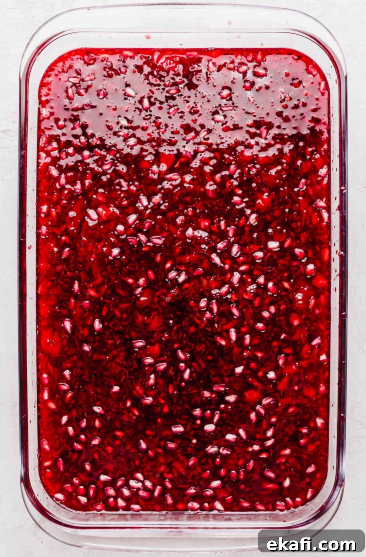 Ruby Pomegranate Delight 8 Pomegranate Jell-O in a rectangular glass dish.